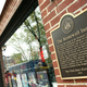 Plaque on New York City’s historic Stonewall Inn outlines its landmark status as a key element in the history of gay rights
